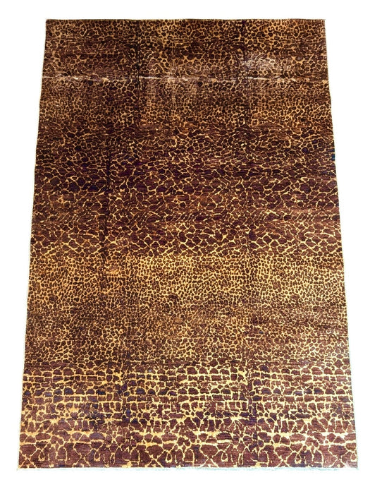 8' x 12' rectangular brown & tan animal print leopard pattern modern area rug isolated on a white background.