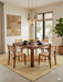 8' x 8' Square Beige Orange Geometric Modern Area Rug placed in a minimalist dining room with a wooden table and woven chairs.