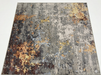 8' x 8' Square Gray Gold Abstract Modern Washable Area Rug displayed on a white background.
