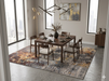 8' x 8' Square Gray Gold Abstract Modern Washable Area Rug featured in a contemporary dining room with a dark wood dining table and six upholstered chairs.
