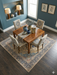 8' x 8' Square Ivory & Navy Blue Floral Medallion Traditional Area Rug showcased beneath a wooden dining table with coordinating upholstered chairs.
