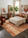 8' x 8' square terracotta & beige textured abstract modern area rug placed in a cozy living room with contemporary furniture and terracotta décor.