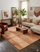 8' x 8' square terracotta & beige textured abstract modern area rug styled in a warm bohemian bedroom with earthy accents and neutral bedding.