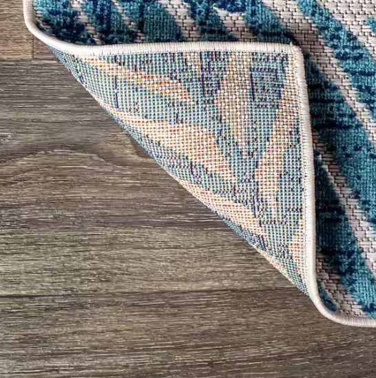 Tropics Palm Leaves Cream/Orange Indoor/Outdoor 5 ft. x 8 ft. Area Rug